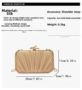 Detailed view of gold pleated evening clutch with branch clasp and chain strap