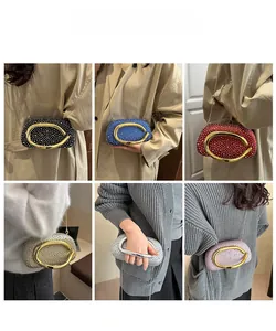 Various colors of sparkling rhinestone clutch bags with metal ring handles and chain straps