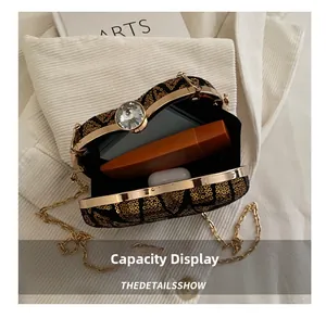 Interior view showing capacity of gold sequin evening clutch bag with crystal lock
