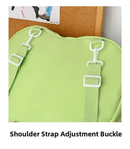 Detail of adjustable strap buckle on a light green apple-shaped bag with nylon texture