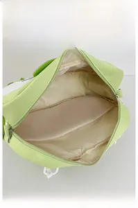 Macro shot of the spacious internal compartment with zipper for apple-shaped backpack