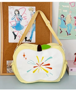 Detailed embroidery of colorful fireworks on a yellow apple-shaped shoulder bag
