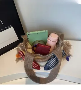 Detail view of woven tote interior showing ample storage for tablet, bottle, and wallet