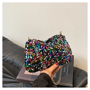 Close-up of vibrant multi-colored sequins and gold chain strap on small crossbody bag