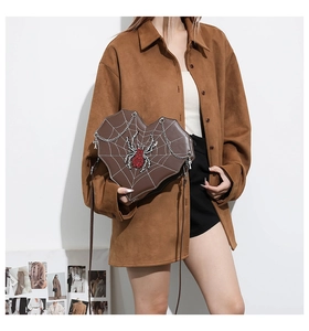 Brown heart-shaped spider web shoulder bag with red rhinestone spider detail and chain