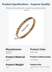 Detail view of a 6mm gold-plated stainless steel bangle with green enamel floral patterns