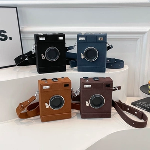 Retro camera-shaped crossbody bag set in black, blue, caramel, and dark brown suede finish