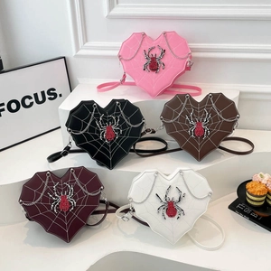 Gothic heart-shaped crossbody bag with spider web pattern and rhinestone detail