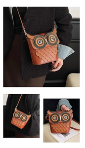 Detail of creative owl-shaped crossbody bucket bag with layered leather feathers