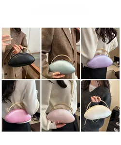 Detail view of oval evening clutch bags in six vibrant colors with gold metal handles