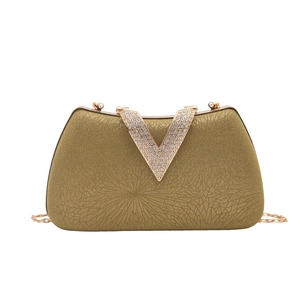 Sparkling gold evening clutch bag with rhinestone V-clasp and metallic chain strap