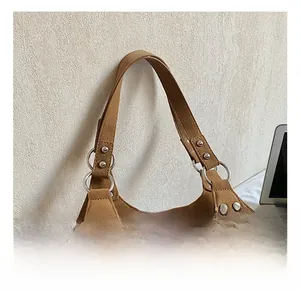 Close-up of comfortable thick handle with silver metal rings and rivets on vintage tote