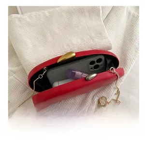 Internal capacity of the red evening clutch bag with chain strap and phone storage