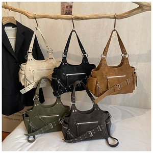 Detail of vintage studded handbags in five colors with zippers and buckle accents
