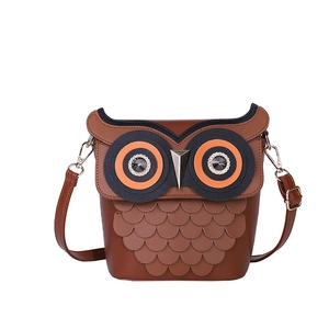 Quirky brown owl crossbody bucket bag with layered leather feathers and adjustable strap