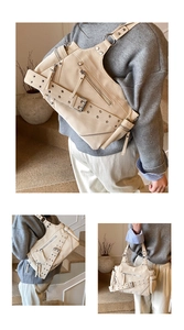 Detail view of cream white motorcycle bag with punk rivets, zippers, and belt buckles