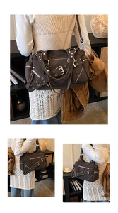 Close-up of vintage grunge motorcycle bag with metal rivets and multi-pocket details