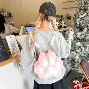 Pink plush cat paw backpack featuring soft faux fur and white round toe pad details