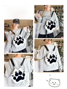 Detail of plush cat paw shoulder bag with white faux fur and adjustable nylon strap