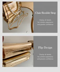 Details der goldenen Abendtasche mit horizontalen Wellen und großem Perlengriff