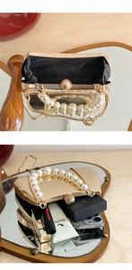 Detailansicht der goldenen Abendtasche mit Perlengriff und schwarzem Innenfutter