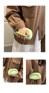 Detail of light green oval ring evening bag with gold chain and unique matte finish