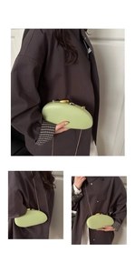 Detail of light green acrylic clutch with bicolored metal pebbles clasp and gold chain