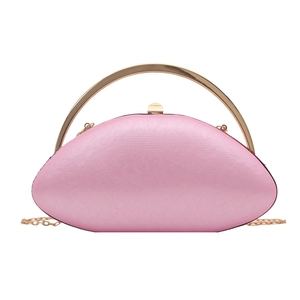 Pink oval acrylic clutch bag with gold round handle and fine chain strap for women