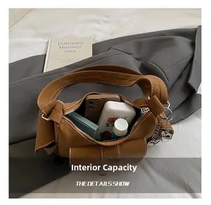 Detailed interior view of a brown vintage tote showing large capacity for essentials