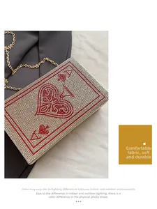 Detail of spade A playing card clutch bag with red and silver rhinestone crystals