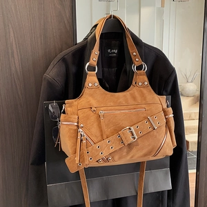 Retro brown rivet bucket bag with multi-pocket design for shoulder and crossbody wear