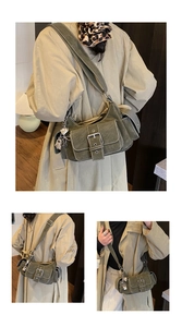 Detail view of olive green canvas messenger bag with silver heart lock and utility pockets