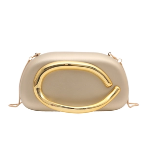 Champagne gold acrylic box bag with a large metallic C-shaped buckle and chain strap