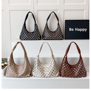 Detailed display of five studded punk hobo bags in black, brown, beige, and cream colors