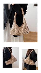 Detail view of beige hobo bag with gold and silver metallic rivet studs for women