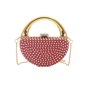 Sparkling red rhinestone evening bag with semi-circular gold handle and metal chain strap