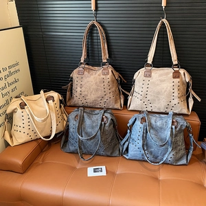 Large capacity vintage rivet tote bag in five colors shown in a lifestyle scene