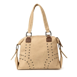 Khaki canvas tote bag with metal studs and brown leather straps on white background