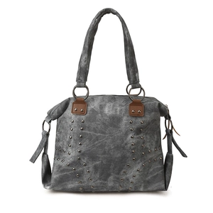 Retro grey canvas tote bag with metal studs and dark brown leather accents in a front view