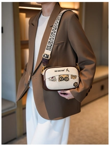 Chic beige crossbody box bag with cute cat print and wide woven shoulder strap detail