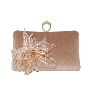 Champagne velvet evening bag with feather floral decoration and crystal ring clasp