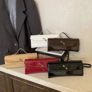 Glossy patent leather crossbody handbags in five colors with golden knot buckles