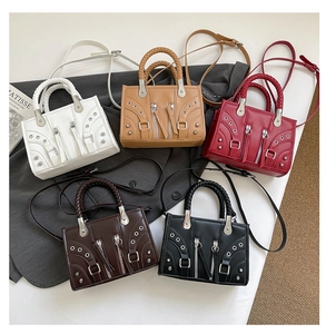 Multi-color vintage crossbody bags display with braided handles and metallic accents