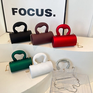 Fashionable acrylic cylinder bag in multiple colors with sleek integrated handle design