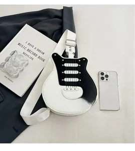 Detailed view of guitar-shaped crossbody bag with metal rivets and PU leather texture