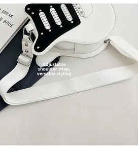 Detail of white PU leather guitar-shaped bag with adjustable strap and silver buckles