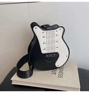 Detail of guitar shaped bag with black and white PU leather and silver metal rivets
