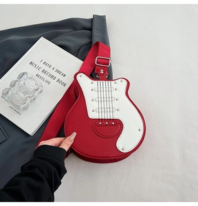 Detailed close-up of guitar-shaped PU leather bag with rivets and music record book
