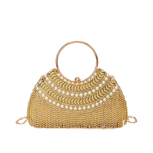 Elegant gold evening clutch bag with luxury pearls and sparkling rhinestone tassels