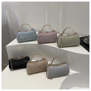 Close-up of rhinestone box clutch bags in six colors with metal handles and chain straps